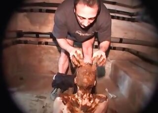 Two perverted men are working together in a scat threesome